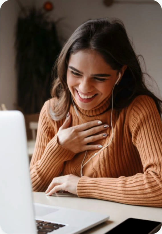 Student laughing during a one-to-one online lesson